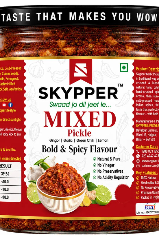 Jar of Skypper mixed pickle with red label and black lid on white background