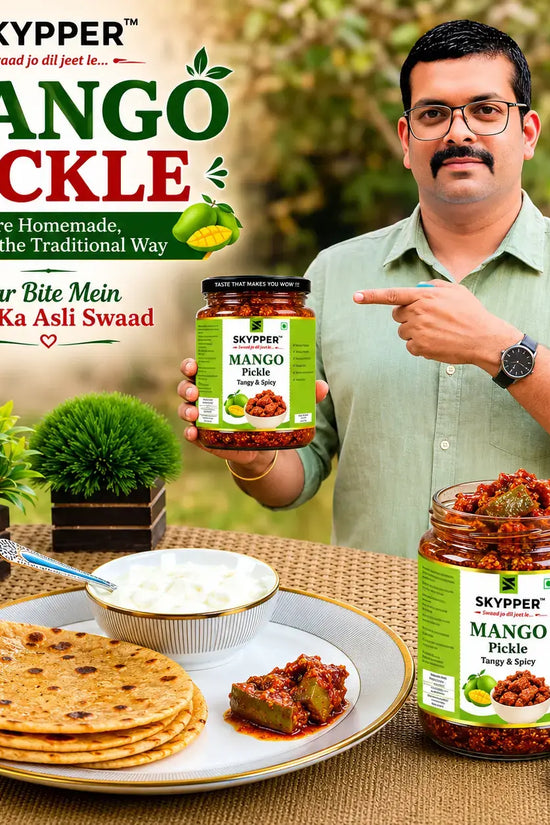 Man pointing at a jar of Skyppper Mango Pickle with food items on a table