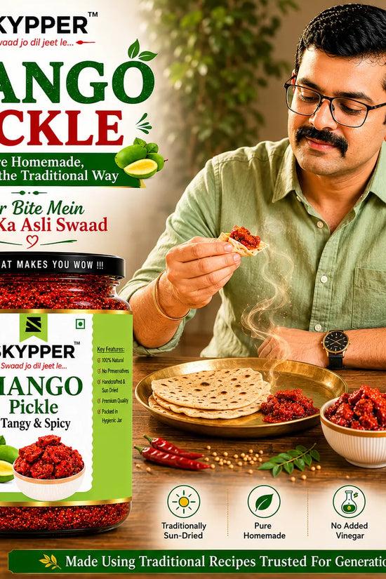 Man eating mango pickle with a jar of Skyppper Mango Pickle in the foreground.